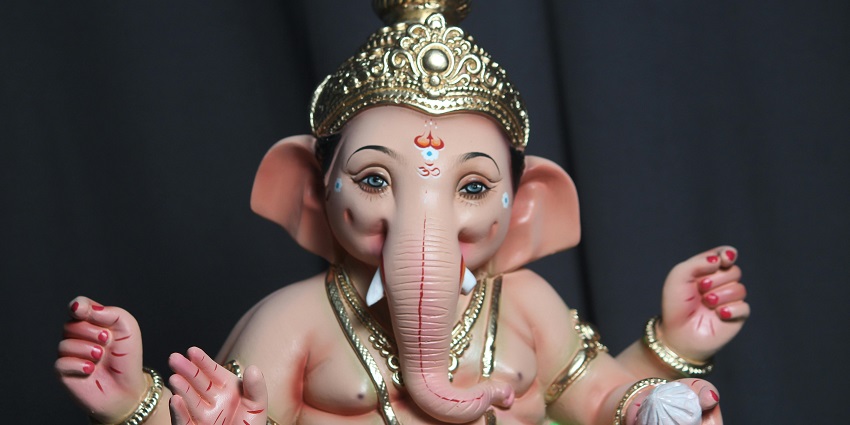A beautiful picture of a sculpture of Lord Ganesha taken from a close-up angle