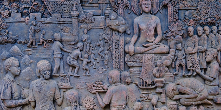 Intricate bas-relief panels of Buddha depicting religious motifs and details.