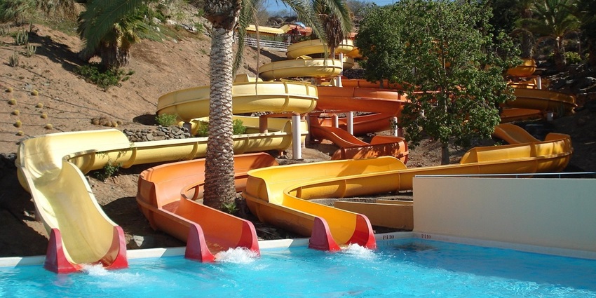 People enjoying a splashing day at the water rides on Adventure Island, one of the best water parks near Rewari