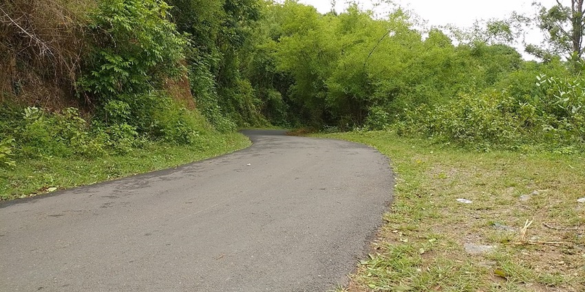 An image of a very peaceful landscape of Agali with rolling hills and forests