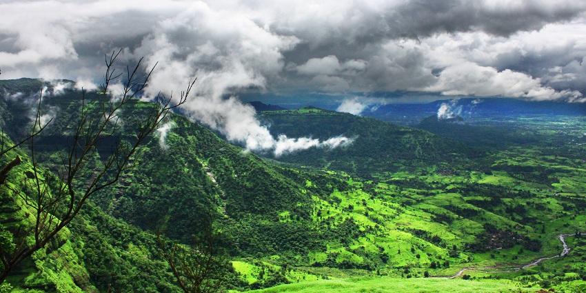A photograph of Ahupe village showing beautiful views from the top with mountains all around.
