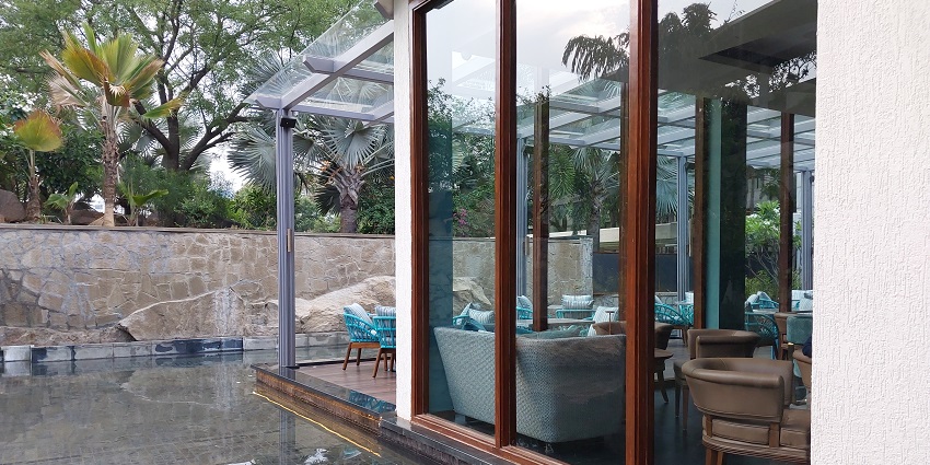 View of the luxurious room with a swimming pool outside, offering a once in a lifetime experience