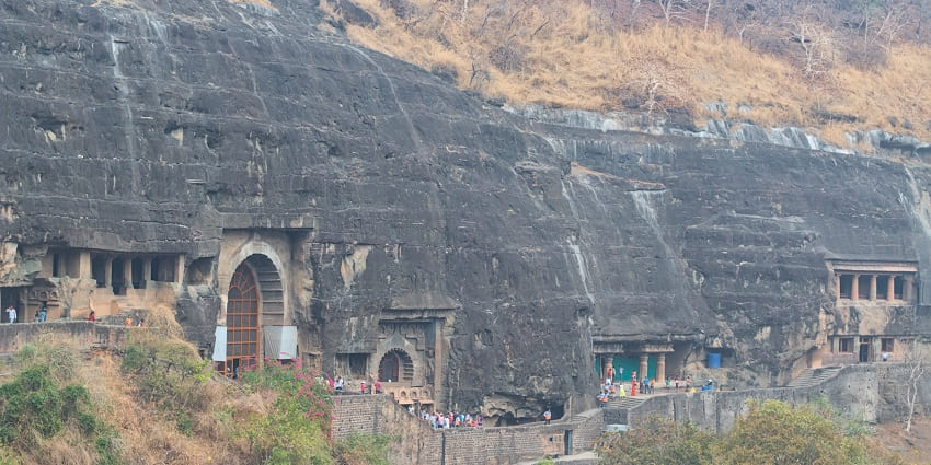 Ancient Buddhist caves carved into a cliff face, famous place near Pitalkhora Caves.