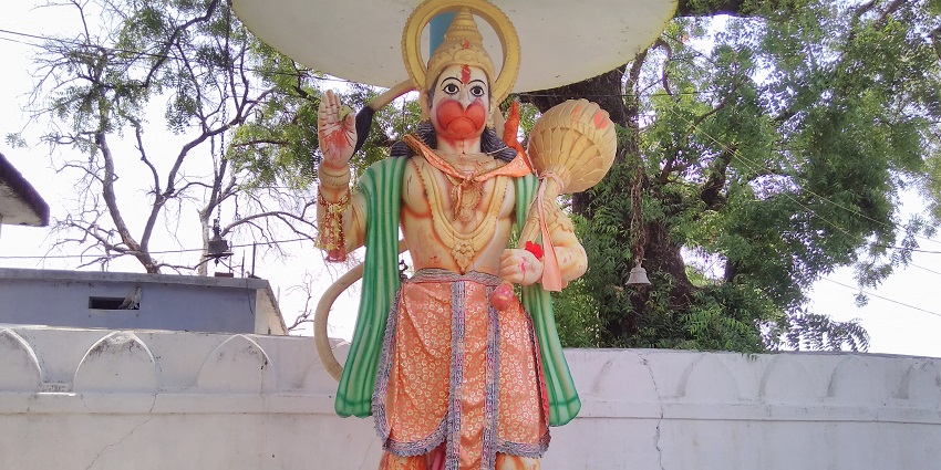 A statue of Lord Hanuman in Odisha, showcasing vibrant colors and intricate details.