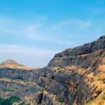 Scenic view of the Alang Traverse showcasing Alang Fort's rugged terrain and rock hills.