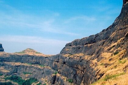 Scenic view of the Alang Traverse showcasing Alang Fort's rugged terrain and rock hills.