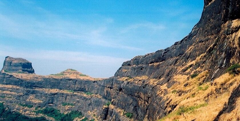 Scenic view of the Alang Traverse showcasing Alang Fort's rugged terrain and rock hills.