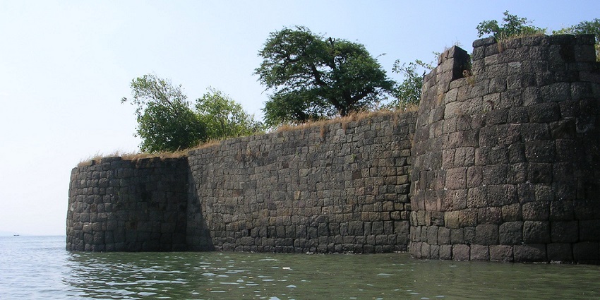 A partially submerged wall of the Kolaba Fort in the coastal town of Alibaug, Maharashtra.