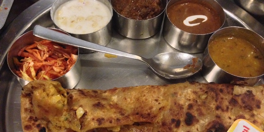 Aloo Paratha: A deliciously stuffed with onion and Potatoes and baked on the hot iron Tawa