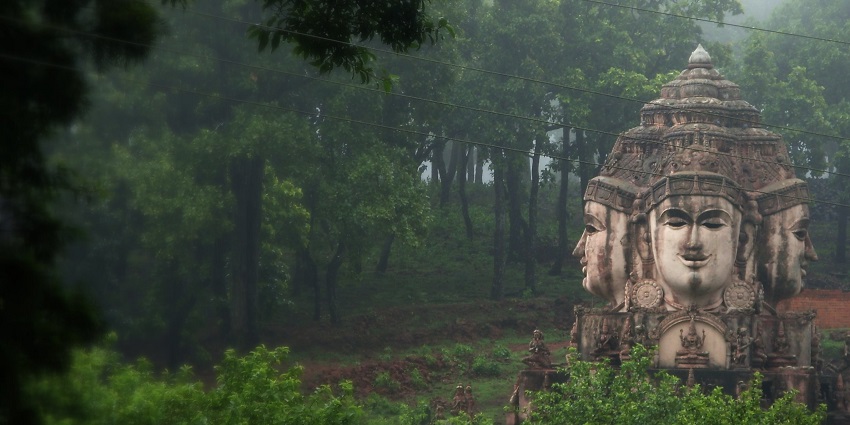 A serene view of Amarkantak’s forest-covered hills and the Narmada River flowing through the valley.