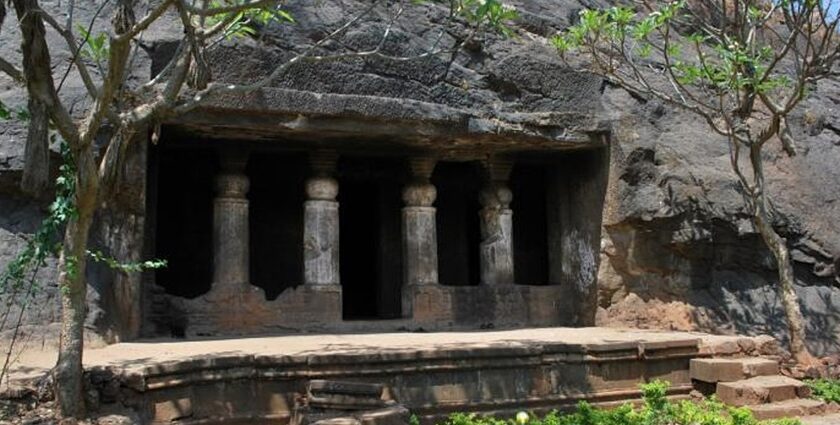 Interior view of Ambivali Caves showcasing intricate carvings and stone formations