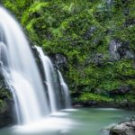 A picturesque view of Amboli Waterfall in Maharashtra cascading down rocky cliffs.