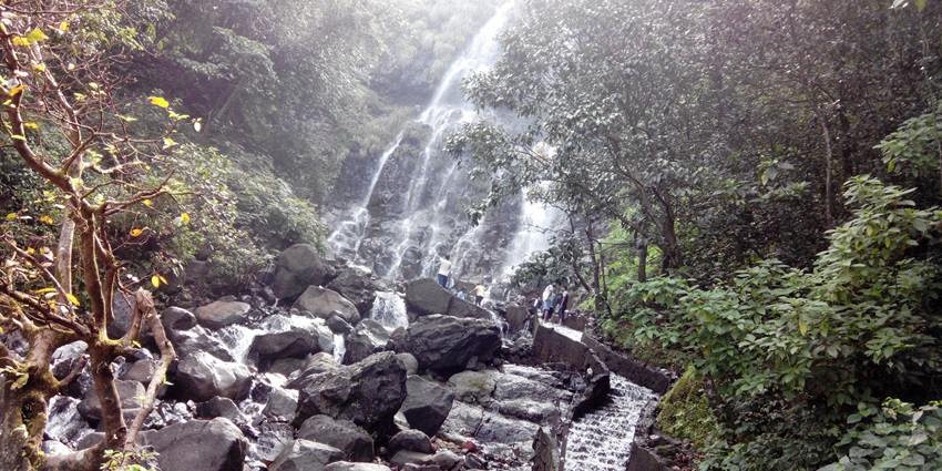 The image depicts a waterfall in Amboli, one of the offbeat hill stations near Pune.