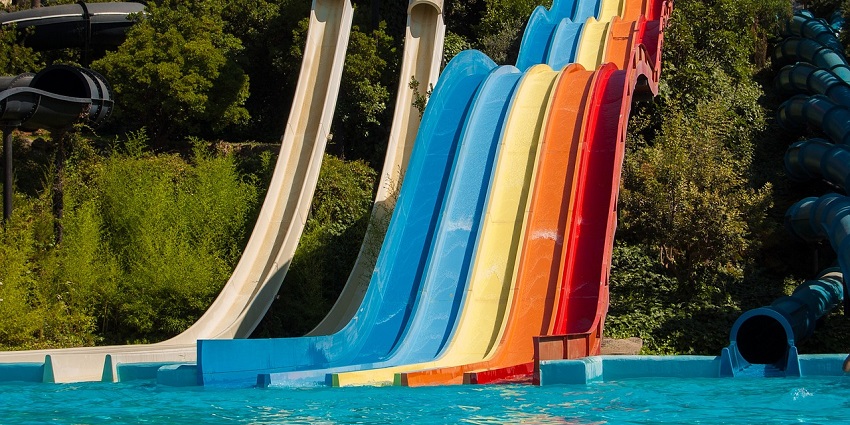 A vibrant outdoor slide enclosed by greenery can be a great place to spend your weekends.