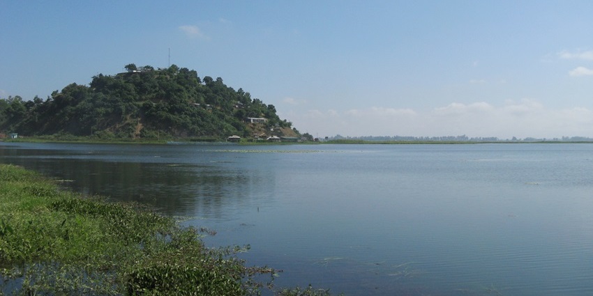 A peaceful lake nestled among paddy fields and areca-nut gardens, offering a serene retreat.