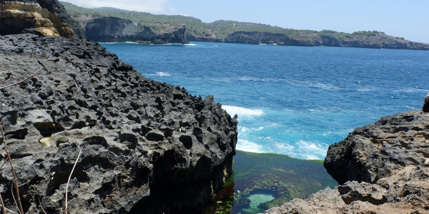 An image of Angel's Billabong, a natural infinity pool surrounded by cliffs