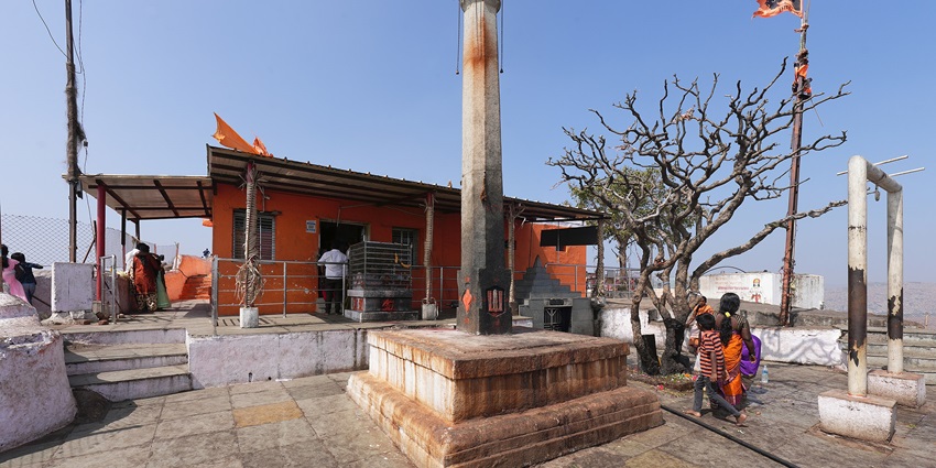 A picture of a temple dedicated to lord Hanuman located on a hill top