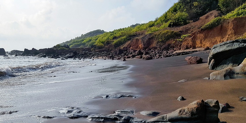 A mesmerising view of Anjuna Beach, one of the top places to visit in Goa with friends.