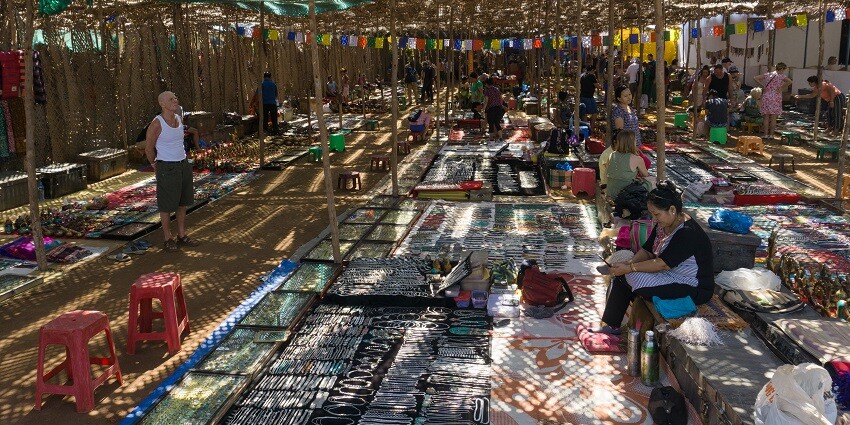 Image of Anjuna Flea Market, female shopkeepers selling jewelleries and more