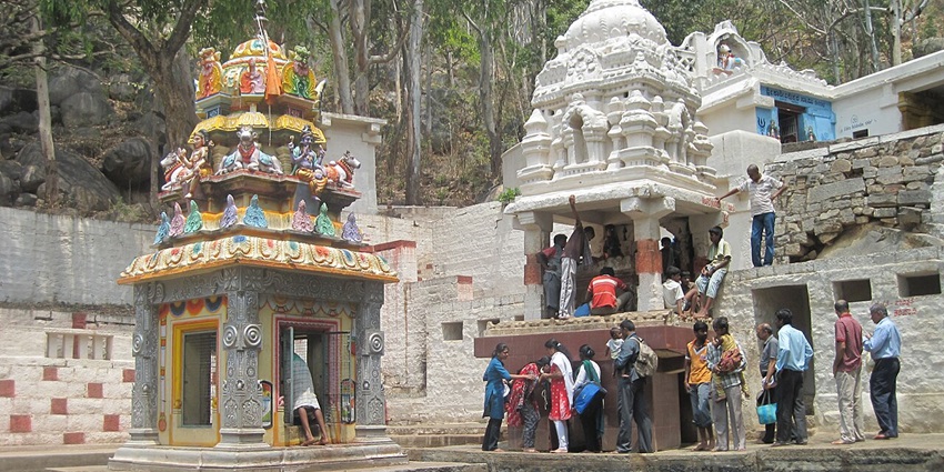 Image of a temple in Antharagange where people are working - places to visit near bangalore within 100 kms