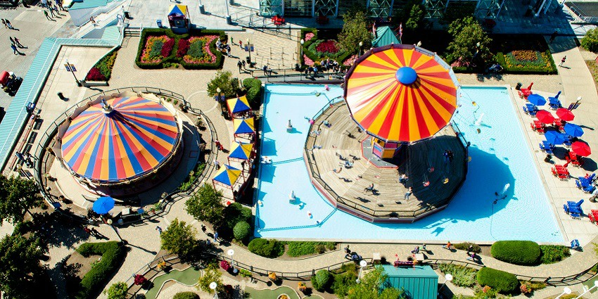 Image of a waterpark from bird eye view with twisty water slides and rides during day time