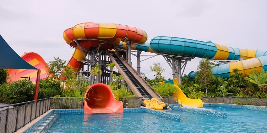 Aqua World water park near Ahmednagar featuring colorful slides and playful water features