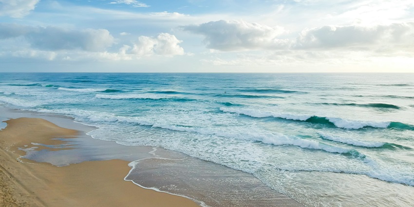 A scenic picture of Ariyaman Beach, with its golden sands and azure waters.
