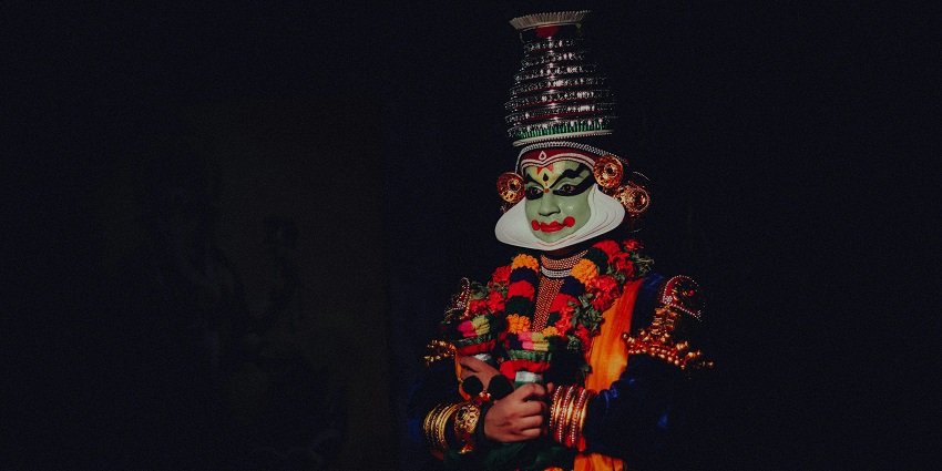 Vibrant display of traditional clothing showcased by a person at Rangoli Metro Art Center.