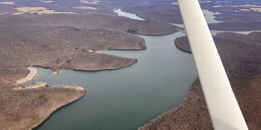 Aerial view of Lake Arthur, a popular destination near Kalsubai with lush greenery