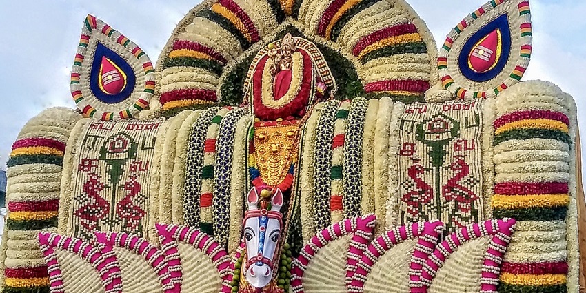 A picture of a decorated, grand idol of Lord Murugan at a Murugan Temple in Tamil Nadu