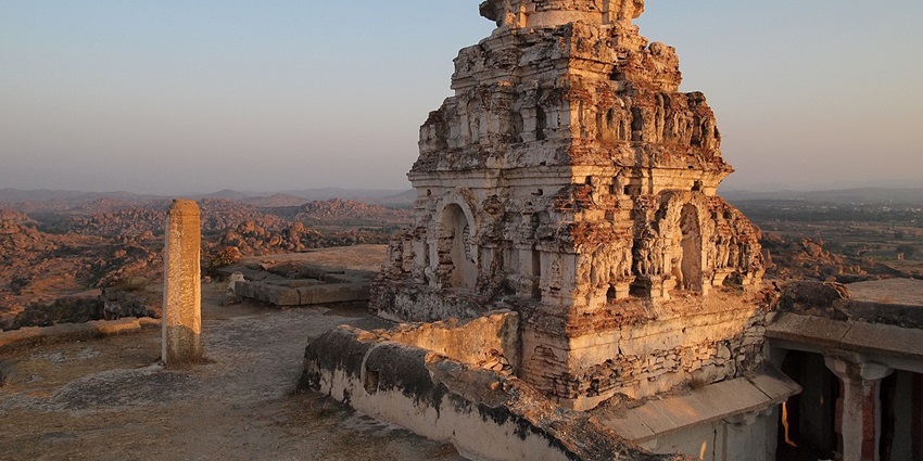 A sacred water source within the Pasupateeswarar Temple complex, surrounded by intricate Dravidian architecture.
