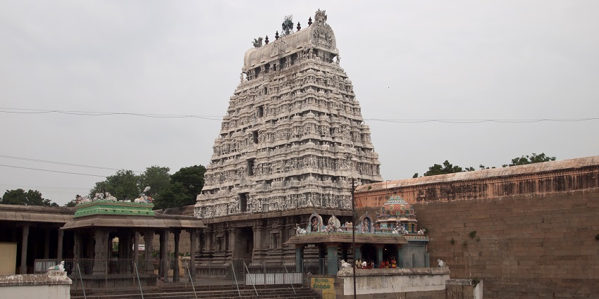 Towering gopuram of Arunachaleswara Temple in Thiruvannamalai, adorned with carvings.