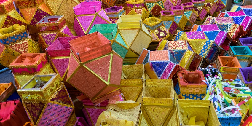 A collection of woven baskets arranged on the ground, showcasing their rustic texture.