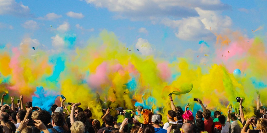 A glimpse of people enjoying and blowing colours for a vibrant festival in Madhya Pradesh.