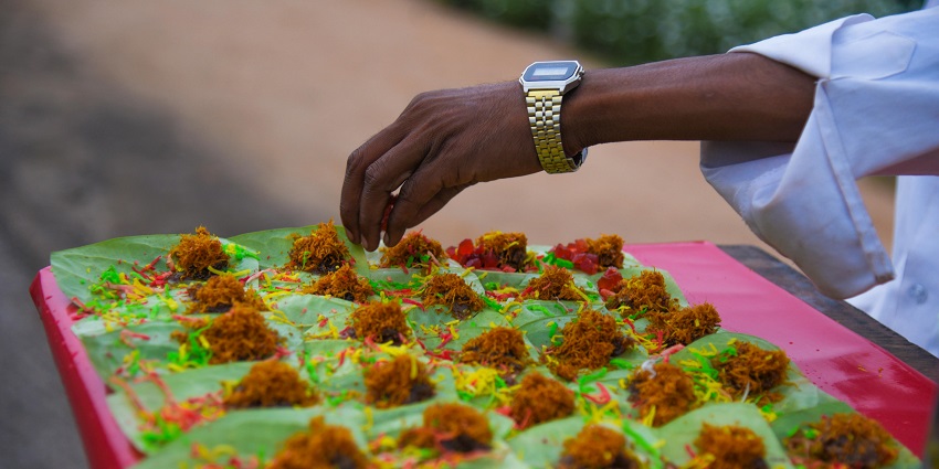 A picture of a colourful scene of a Harvest Festival - multicoloured food stalls and cuisines.