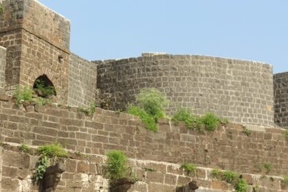 View of a bastion from the ground at Ausa Fort, showcasing its historic structure.