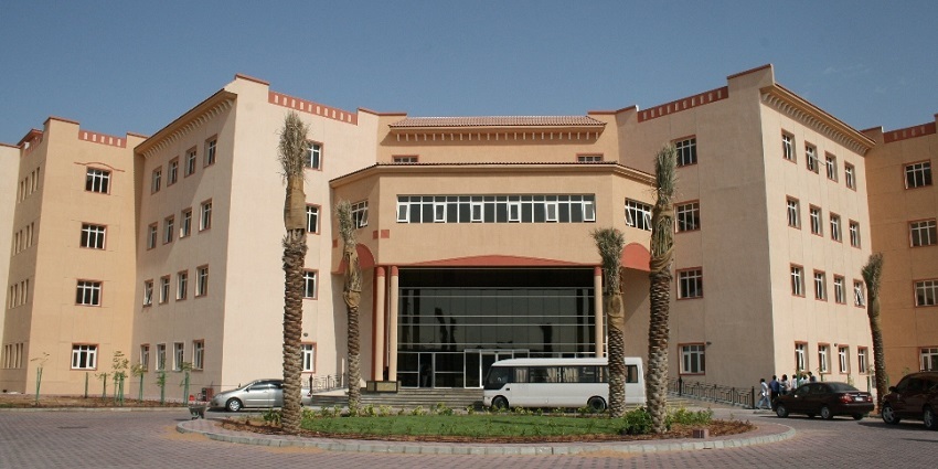 BITS Pilani campus of modern architecture and white buildings with flags hosted