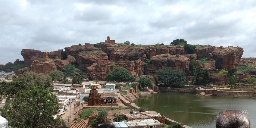 Rock-cut caves of Badami encircled by beautiful red sandstone cliffs.