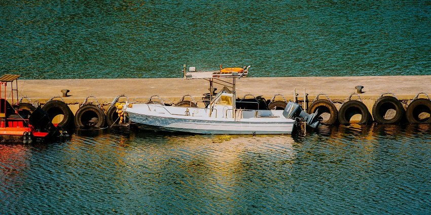 An image of people enjoying a banana boat ride, being towed across the water.