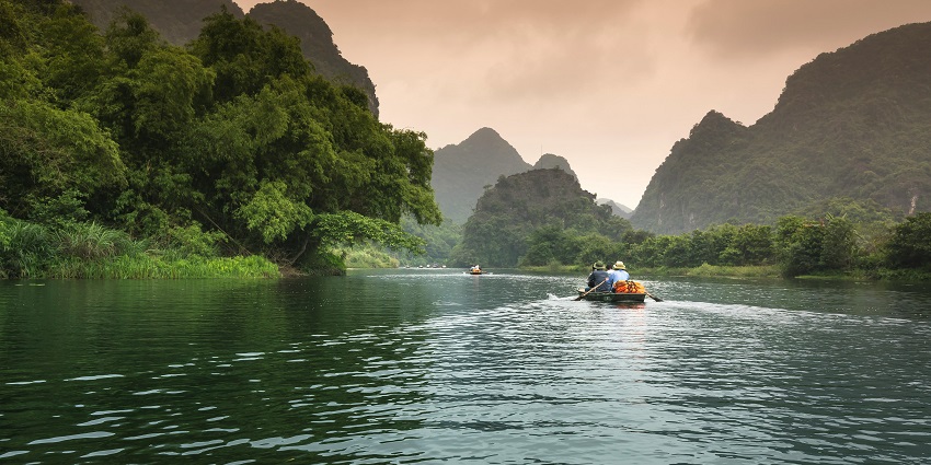 A picture of people doing a Banana boat ride, one of the best Tarkarli Water Sports.
