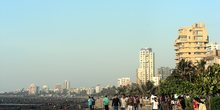 Scenic Bandra Bandstand promenade with palm trees and the Arabian Sea backdrop.