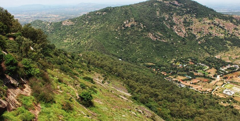 Scenic view of mountains and valley surrounded by lush greenery - places to visit in april near bangalore