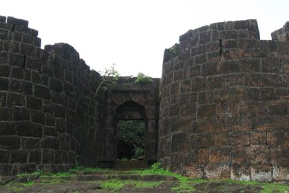 Panoramic view of Bankot Fort, highlighting its stone architecture and coastal surroundings.