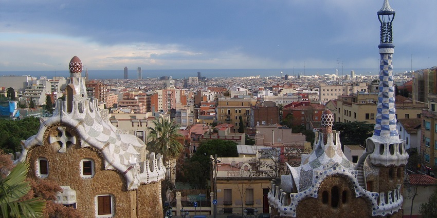 An aerial view of the majestic cityscape of Barcelona with views of the ocean in background