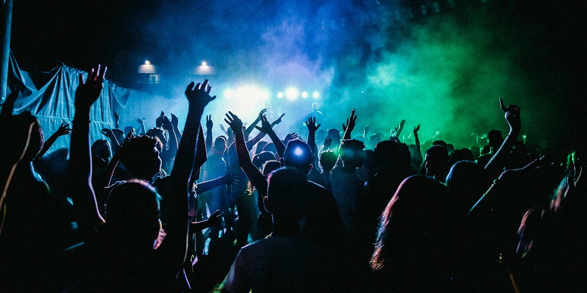 An image of a funky bar with eclectic decor and vibrant party atmosphere.