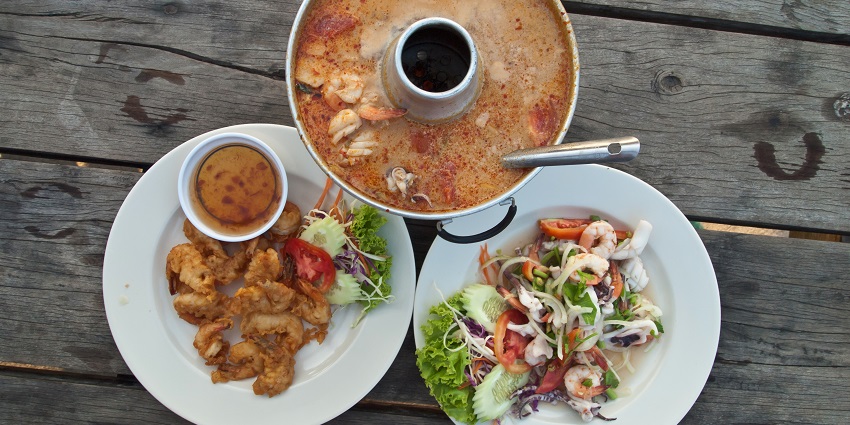 A Thai Seafood thali, consisting of Shrimp soup, a variety of Shrimp dishes, and a salad.