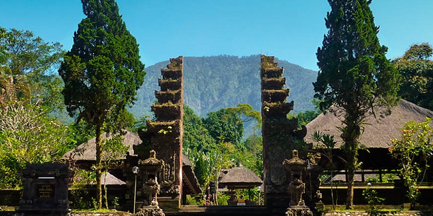 An image of Batukaru Temple nestled in a lush rainforest, one of the famous temples in Bali.