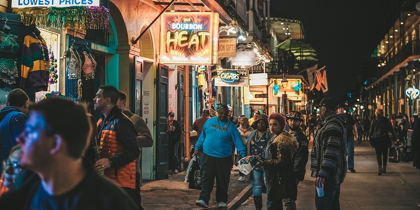 A serene view of people strolling through a street market in for goods.