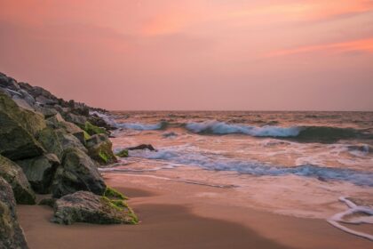 Enchanting view of Kihim beach under vibrant sunset hues, one of the best beaches in raigad