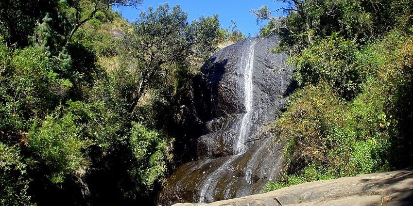 Stunning waterfall surrounded by greenery, ideal for nature lovers.